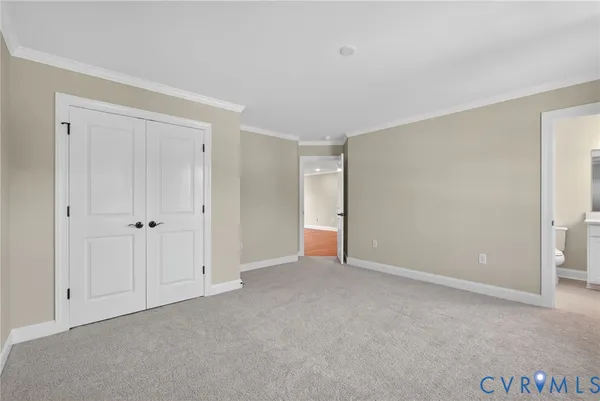 a view of an empty room and closet area