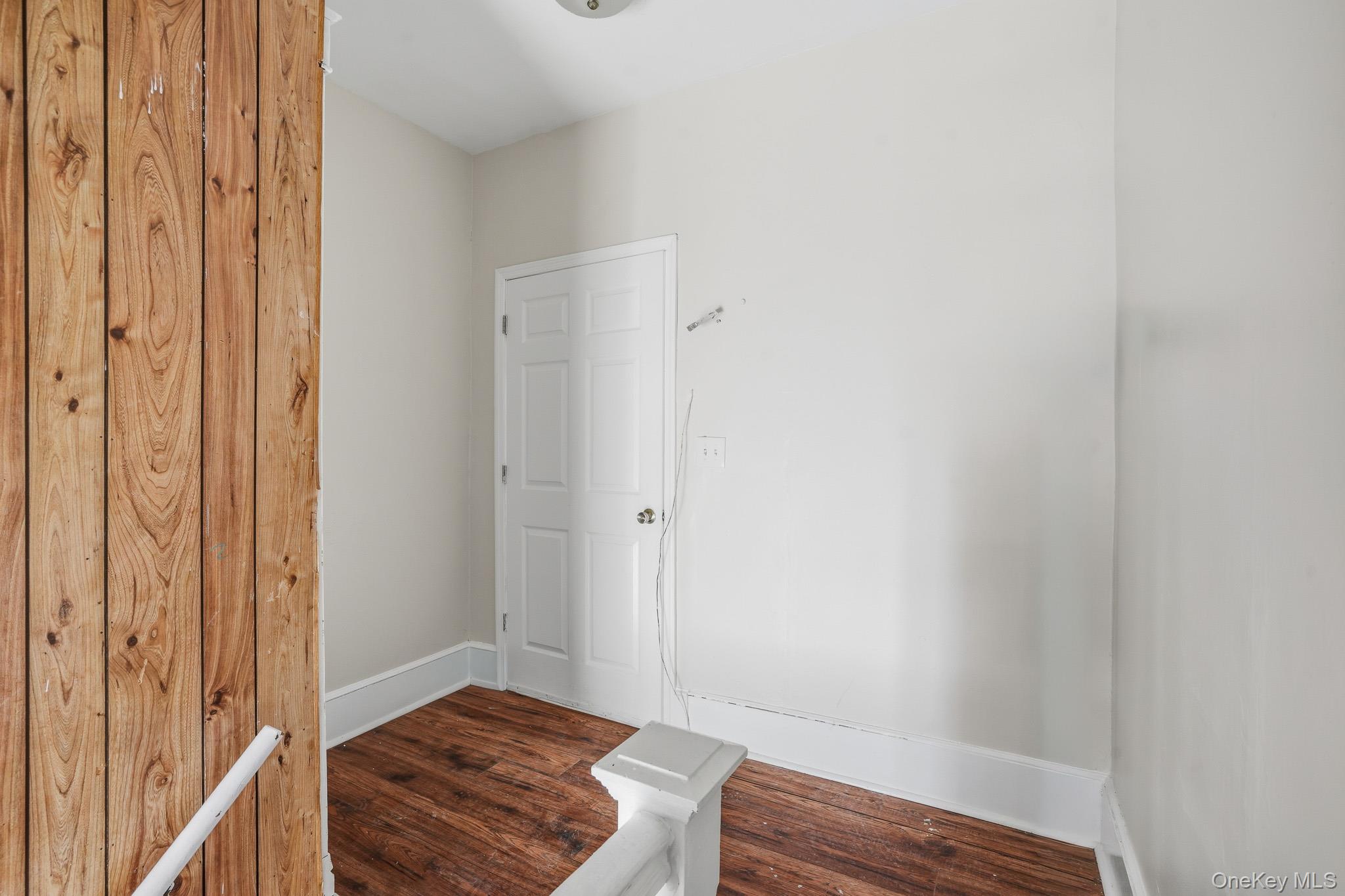 65 North Clinton Street Poughkeepsie, NY 12601 - Photo 21 of 43 a bedroom with a bed and wooden floor