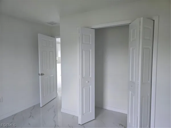 a view of a hallway with closet area