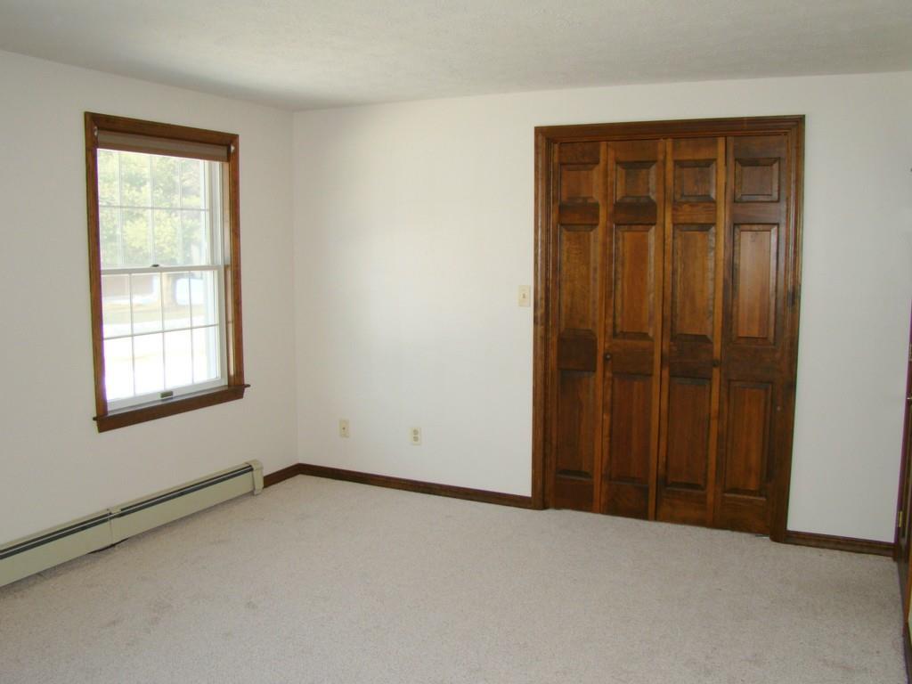 36 Old Carriage Road, Unit 17 Auburn, ME 04210 - Photo 17 of 35 Closet wall of the master bedroom