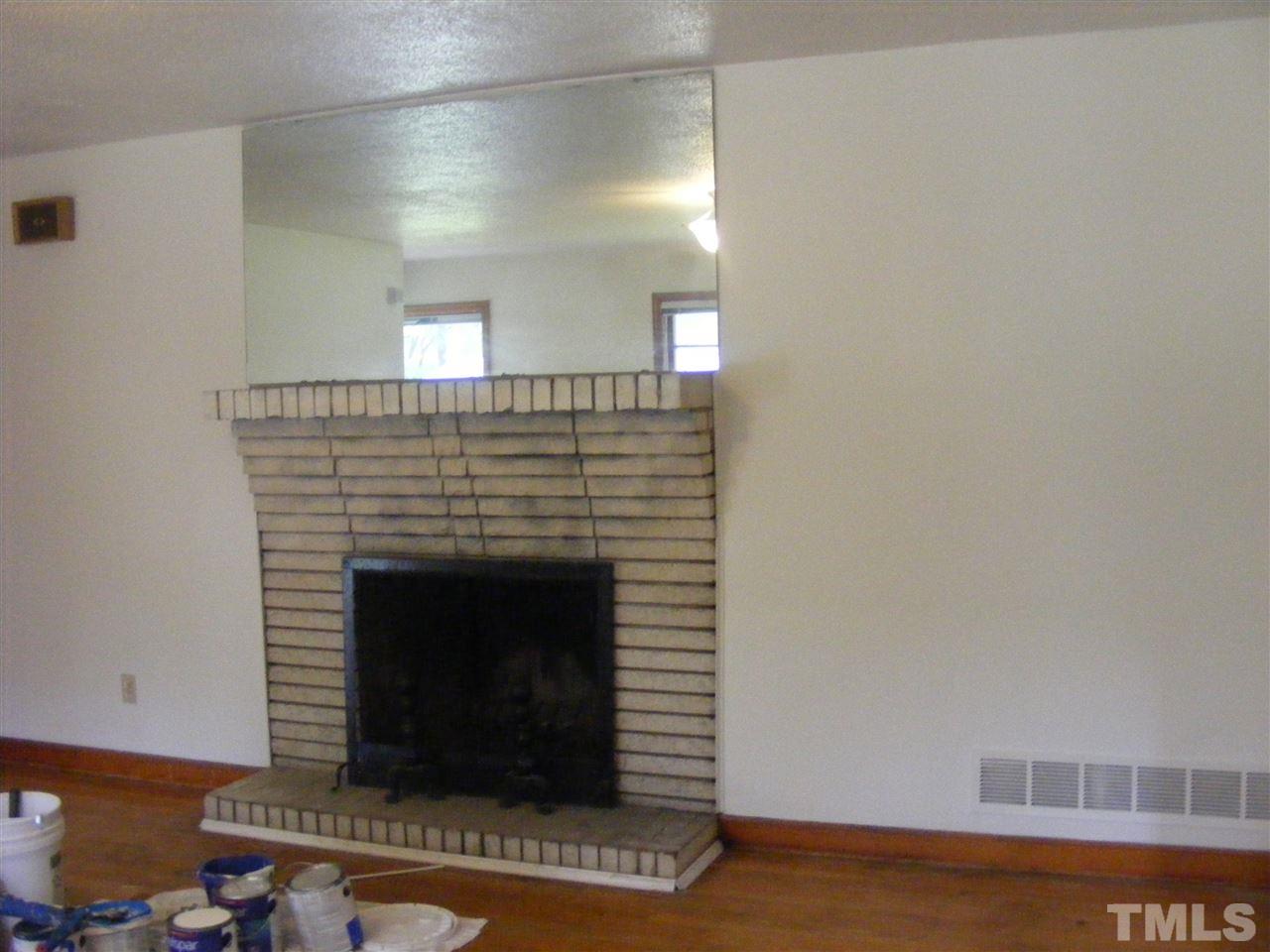 1609 Miller Street Raleigh, NC 27610 - Photo 4 of 8 a living room with a fireplace