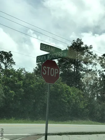 a view of a golf course with a lake view