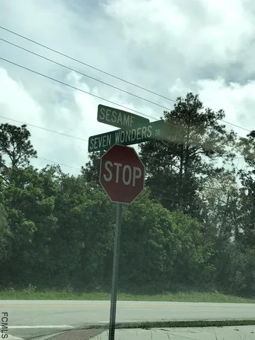 a view of a golf course with a lake view