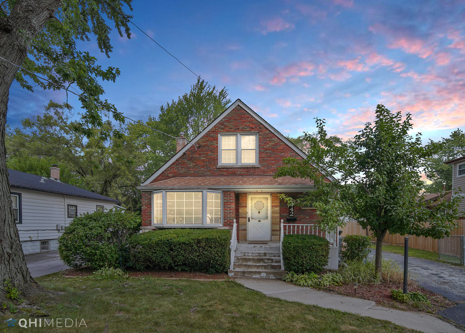 1442 Ridge Road Homewood, IL 60430 - Photo 2 of 25 a front view of a house with a yard