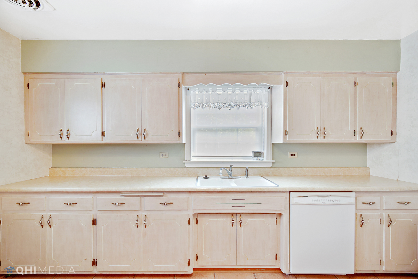 1442 Ridge Road Homewood, IL 60430 - Photo 13 of 25 a kitchen with granite countertop white cabinets and a sink