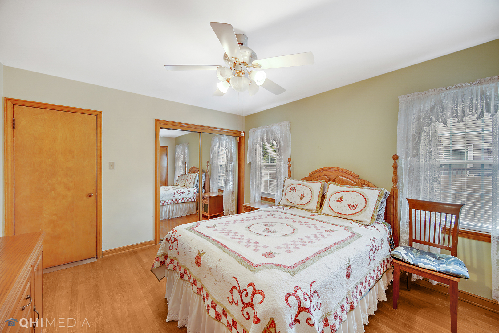 1442 Ridge Road Homewood, IL 60430 - Photo 16 of 25 a bedroom with a bed a dresser and potted plants