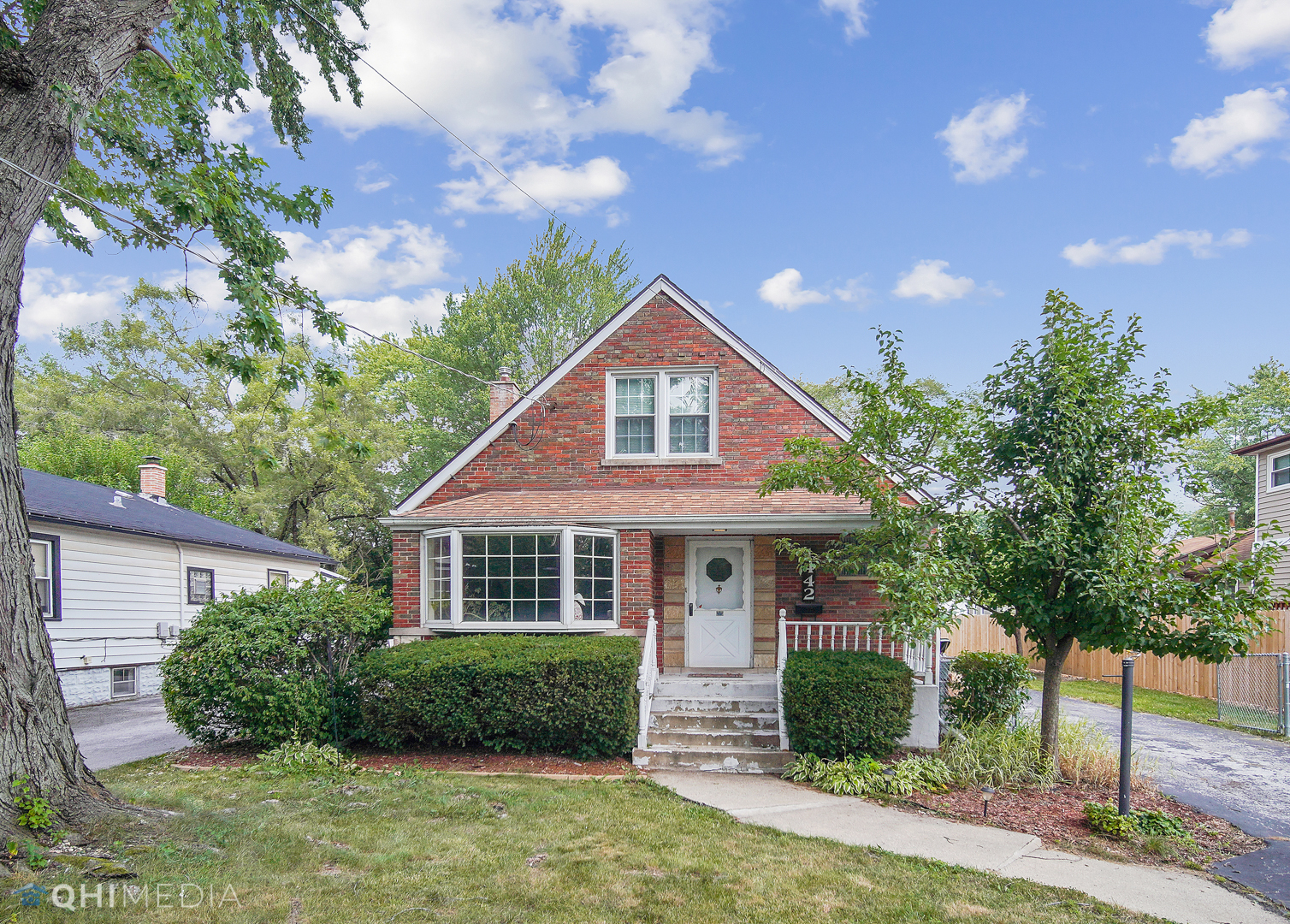 1442 Ridge Road Homewood, IL 60430 - Photo 3 of 25 a front view of a house with a yard