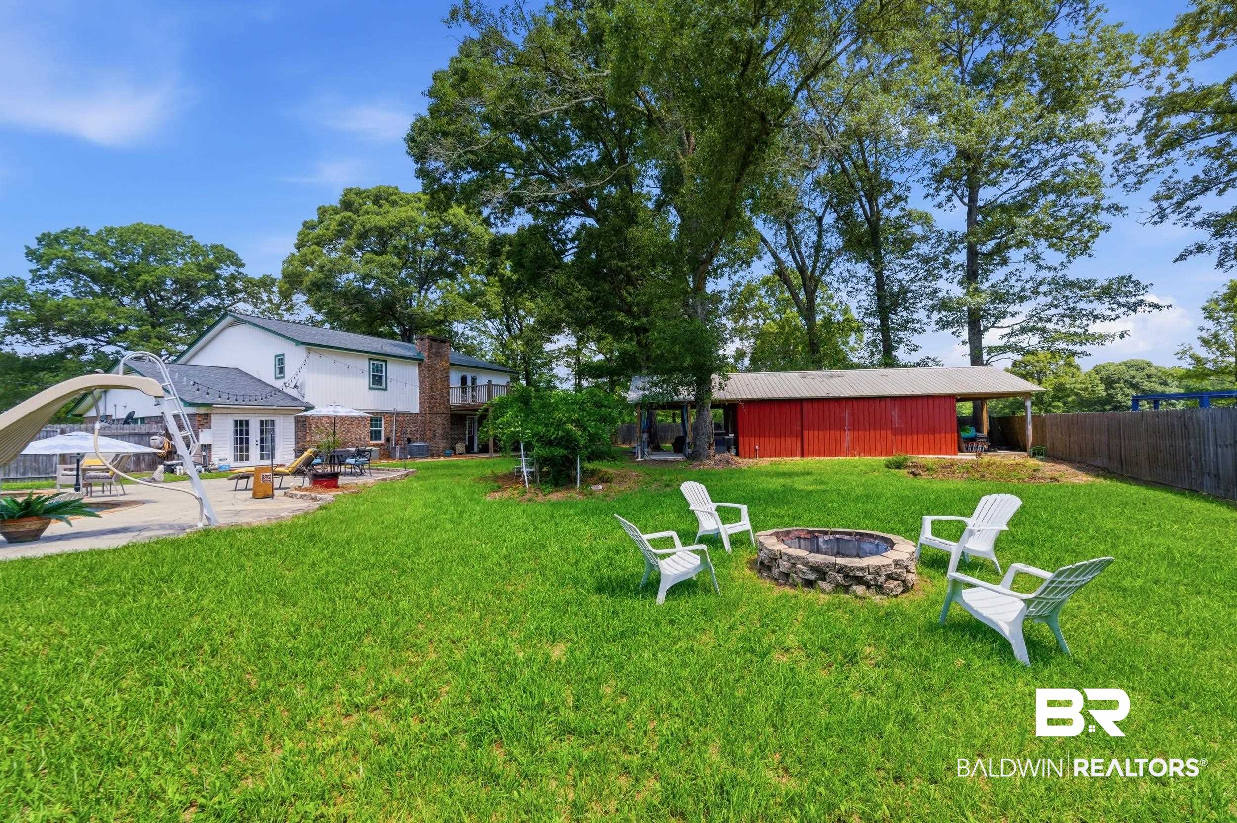 51620 Robert White Road Bay Minette, AL 36507 - Photo 74 of 81 Expansive green lawn with a built-in stone fire pit