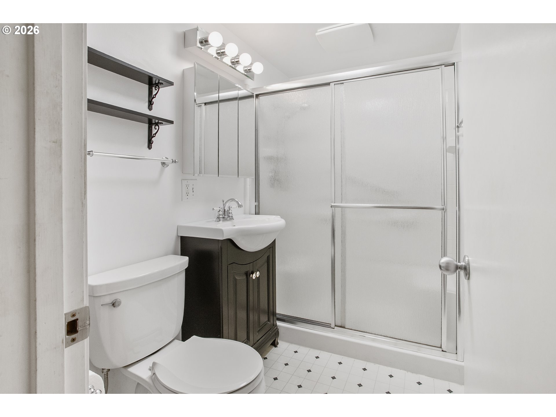 2840 Ferry Street Eugene, OR 97405 - Photo 18 of 35 a bathroom with a sink a toilet and shower