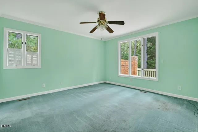 a view of a dining room with furniture wooden floor and a chandelier