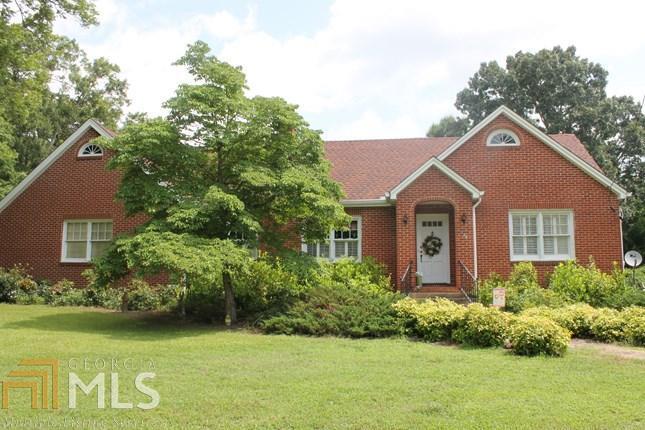 230 West Main Street Rutledge, GA 30663 - Photo 1 of 1 a front view of a house with a garden