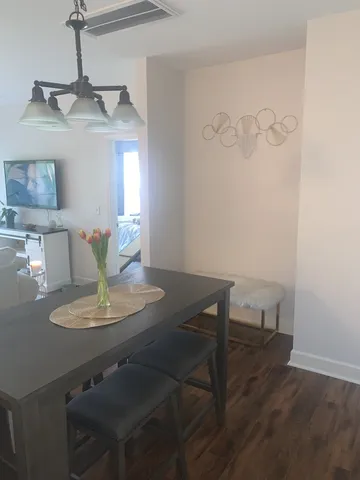 a view of a dining room with furniture