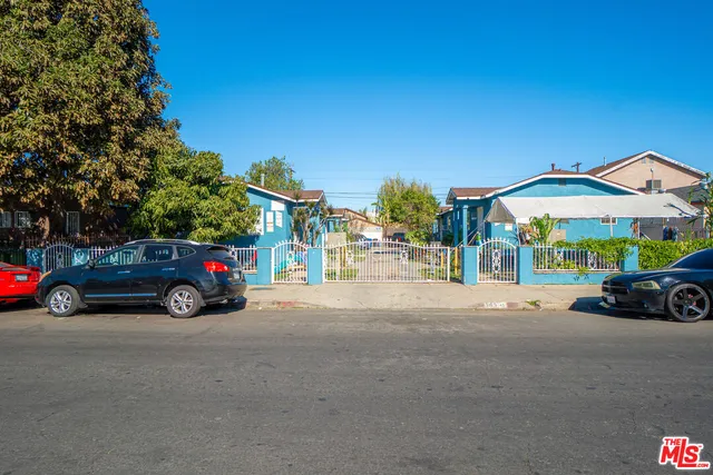 a view of a car parked in front of a house
