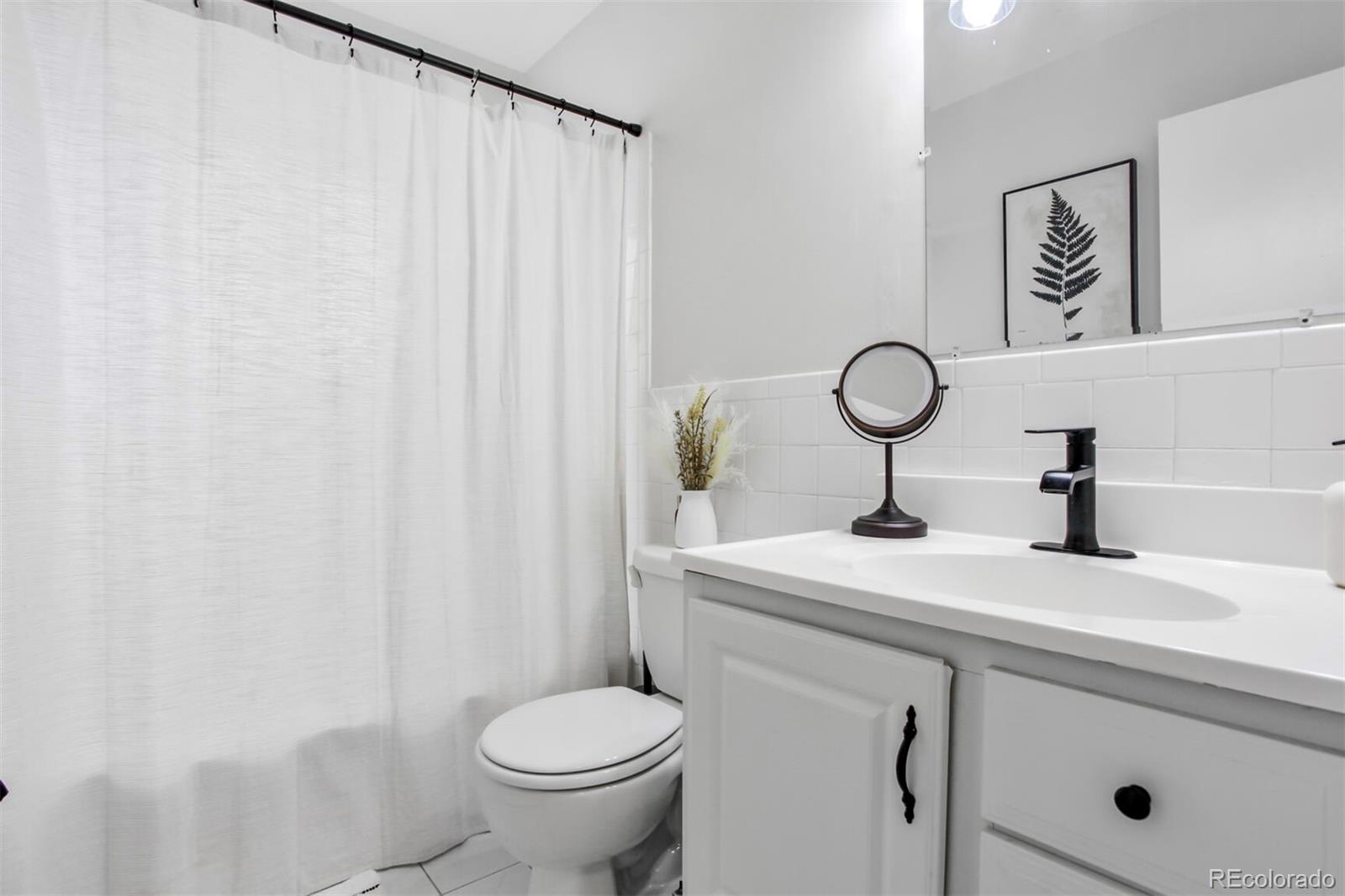 830 20th Street, Unit 304 Boulder, CO 80302 - Photo 16 of 25 a bathroom with a sink and a toilet