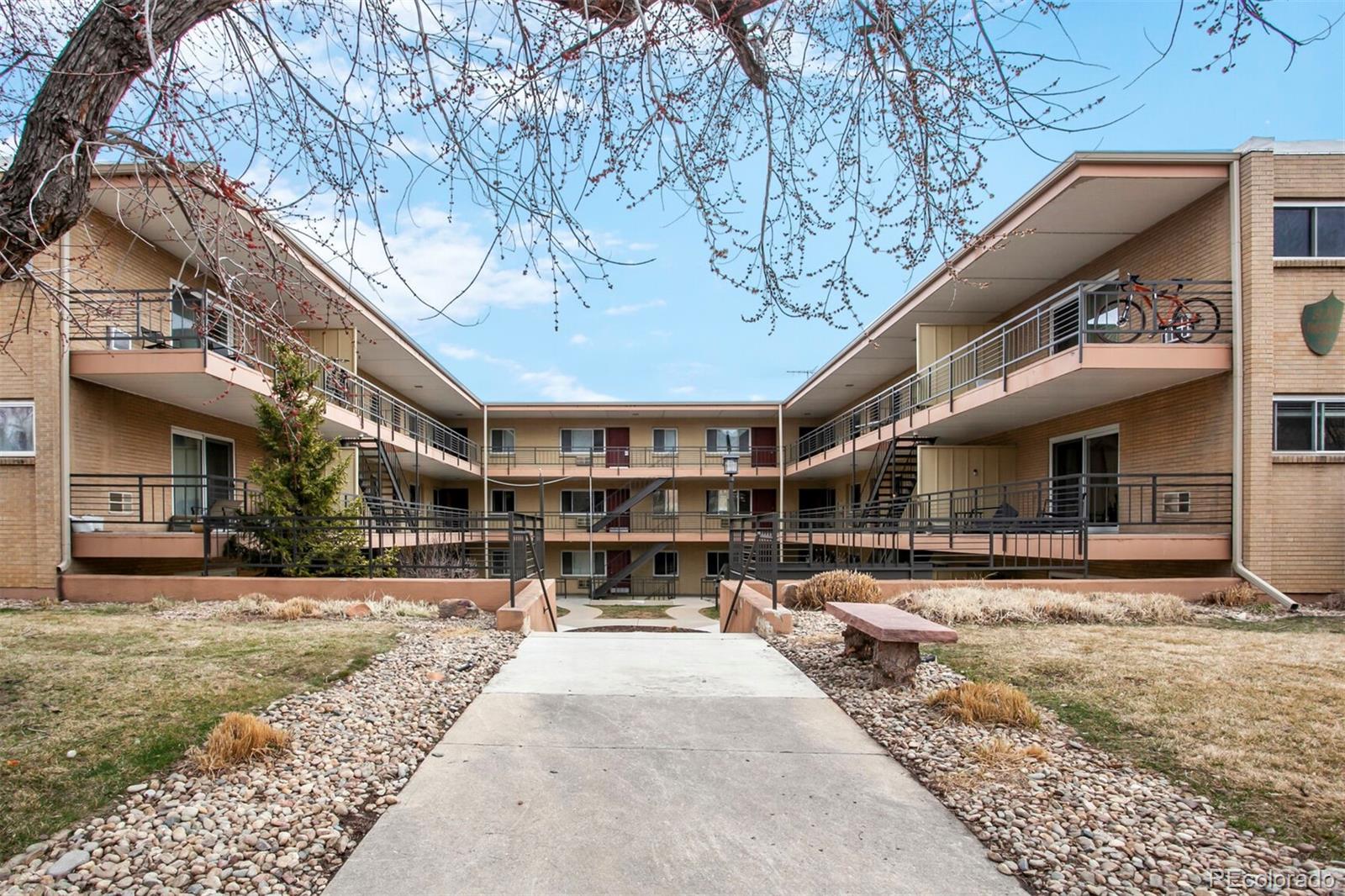 830 20th Street, Unit 304 Boulder, CO 80302 - Photo 24 of 25 a view of large building with a yard