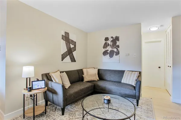 a living room with furniture and a rug