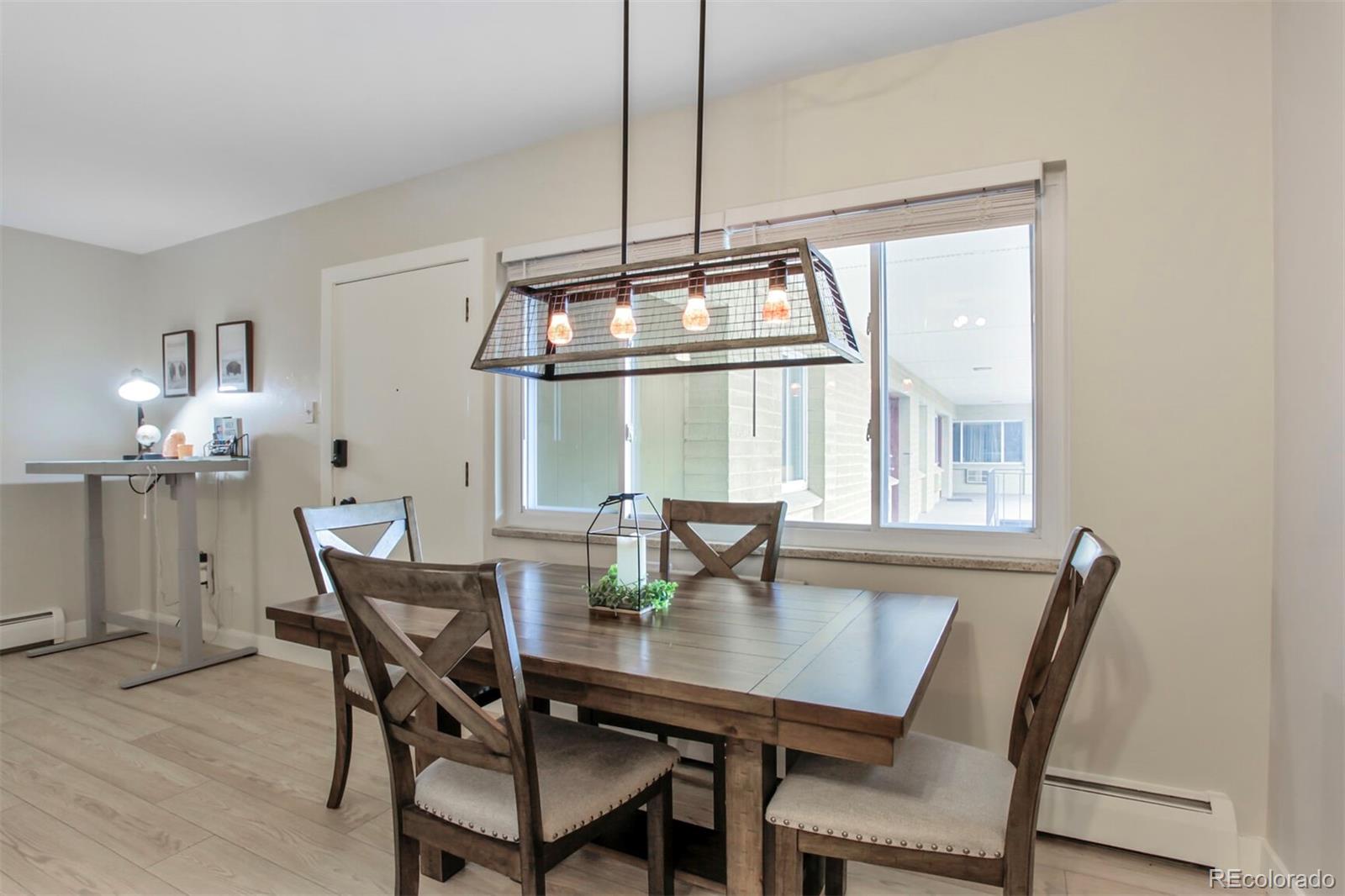 830 20th Street, Unit 304 Boulder, CO 80302 - Photo 8 of 25 a view of a dining room with furniture and window