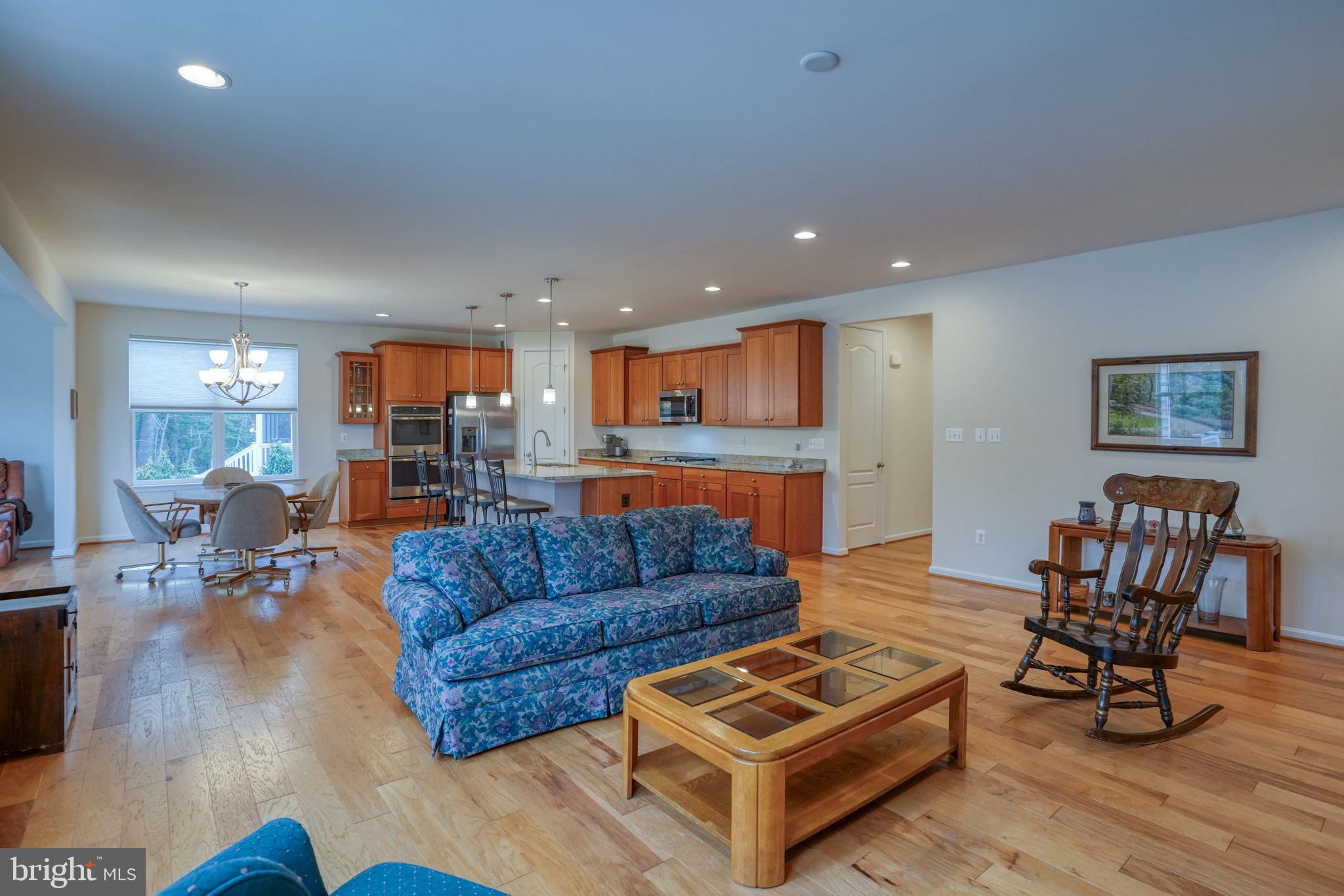 34273 Spring Brook Avenue Lewes, DE 19958 - Photo 19 of 73 a living room with furniture and a wooden floor