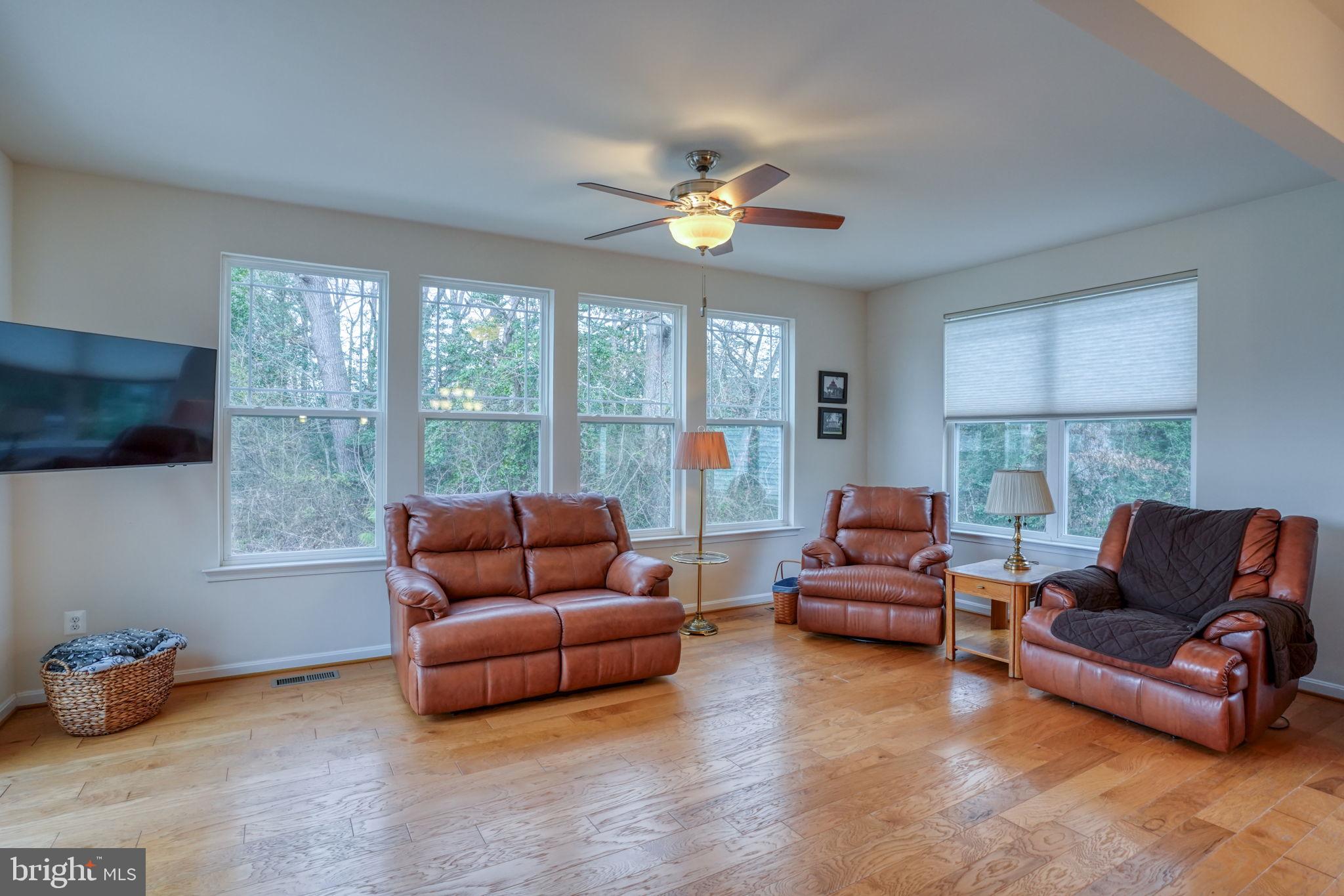 34273 Spring Brook Avenue Lewes, DE 19958 - Photo 21 of 73 a living room with furniture and a large window