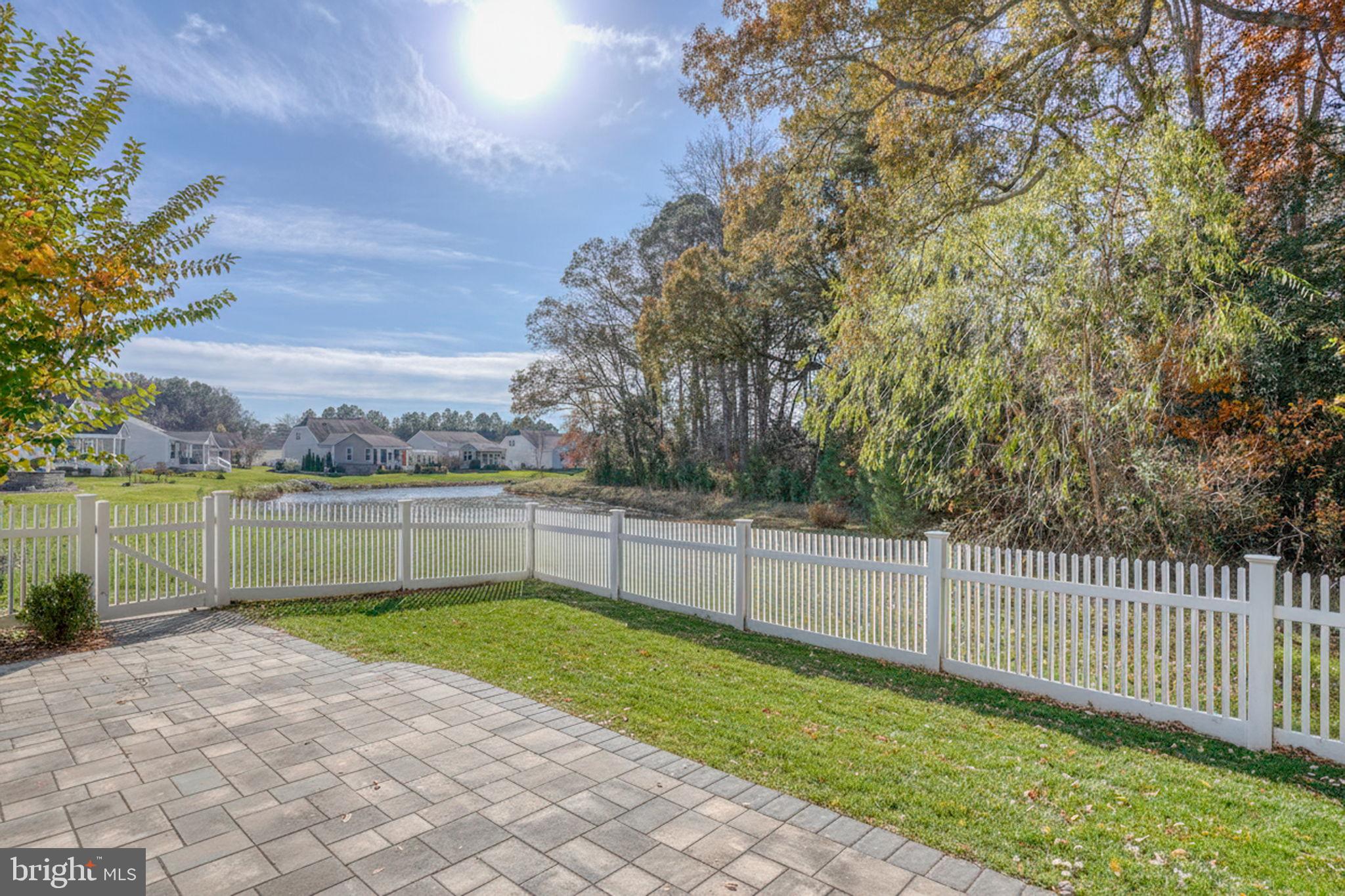 34273 Spring Brook Avenue Lewes, DE 19958 - Photo 3 of 73 a view of lake with green space