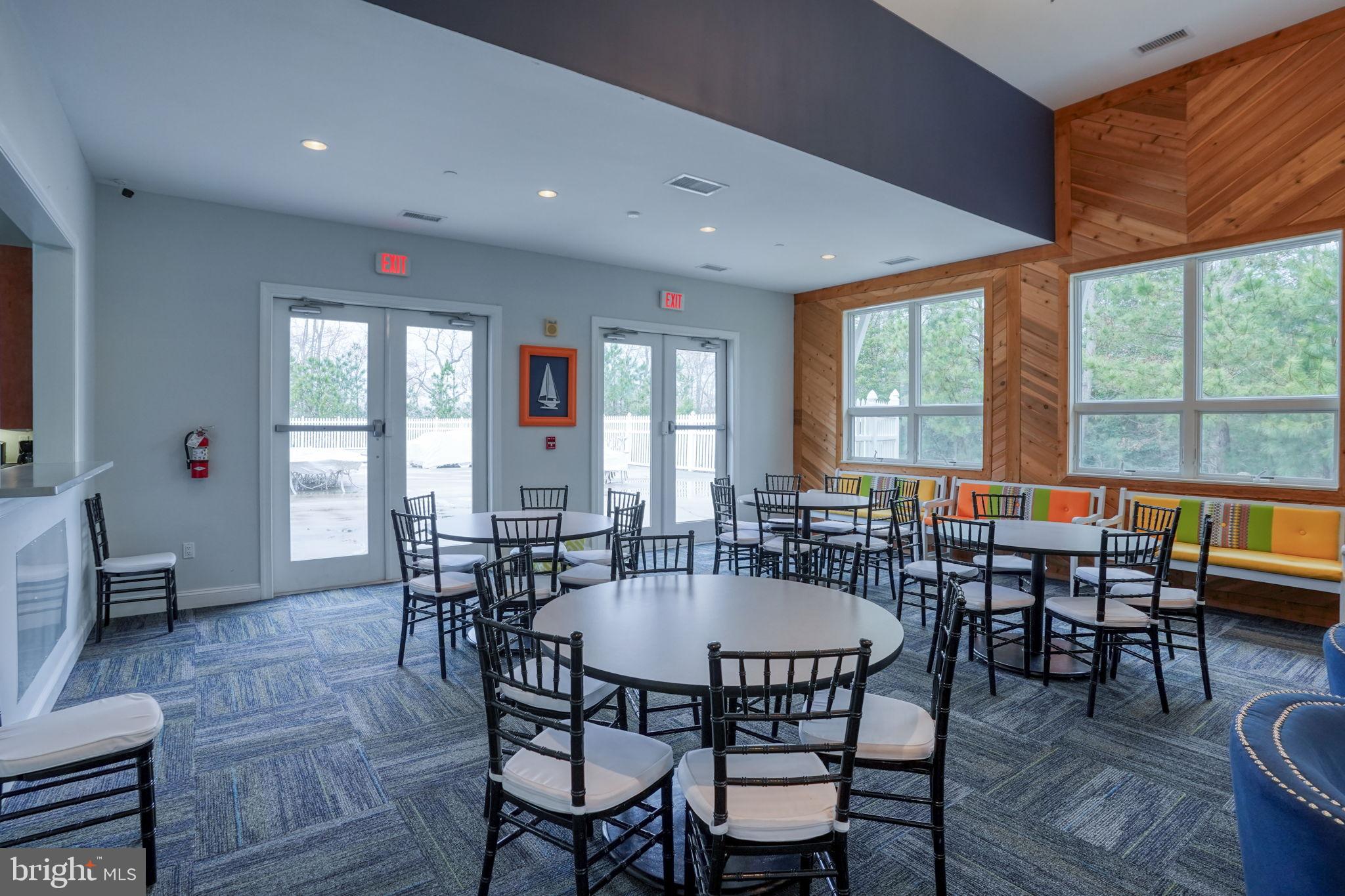 34273 Spring Brook Avenue Lewes, DE 19958 - Photo 55 of 73 a dining room with furniture window wooden floor