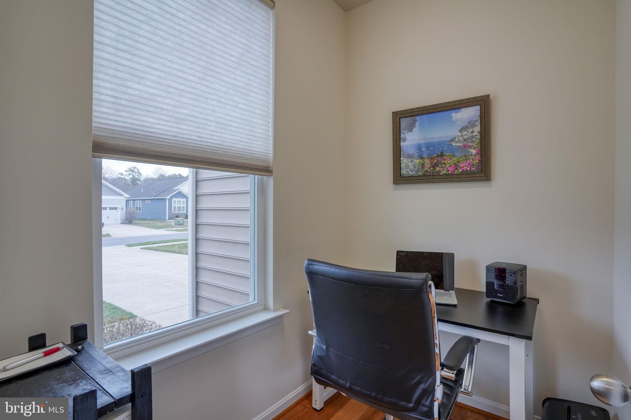 34273 Spring Brook Avenue Lewes, DE 19958 - Photo 9 of 73 a view of a workspace with furniture and a window