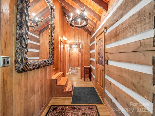 a large bedroom with a large bed and a fireplace