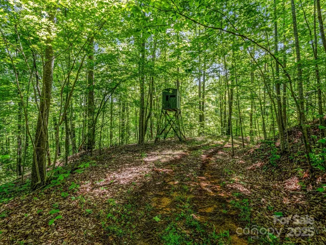 a balcony with furniture and a large window