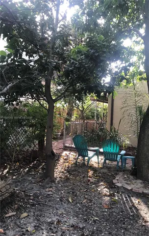 a view of a bench in a backyard