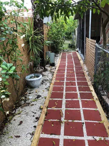 a view of a backyard with sitting area
