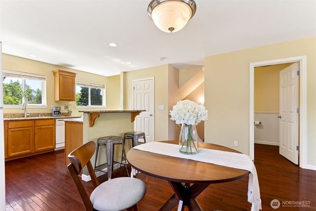 a room with dining table and a sink
