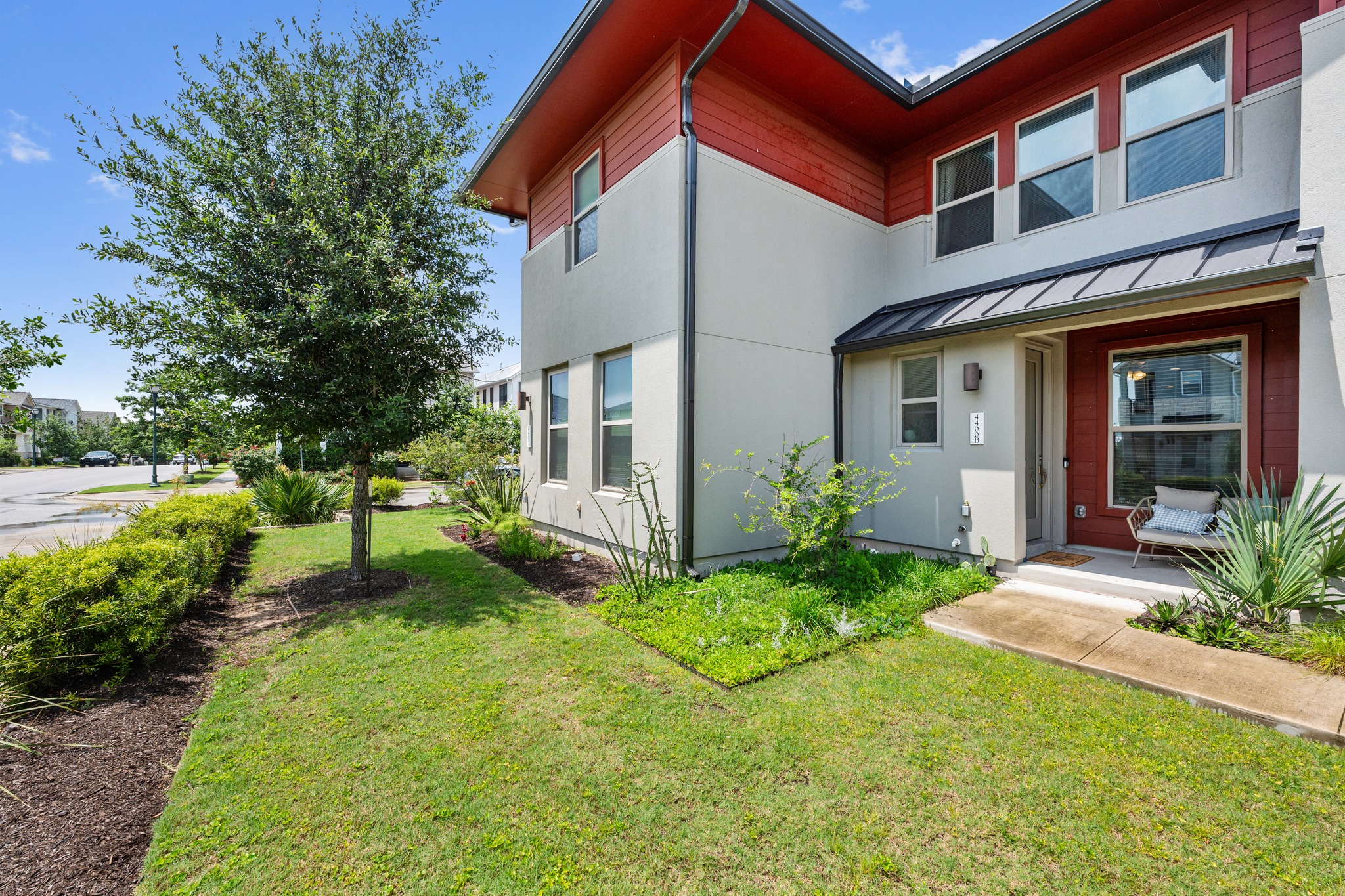 4400 Vaughan Street, Unit B Austin, TX 78723 - Photo 2 of 29 a front view of a house with garden