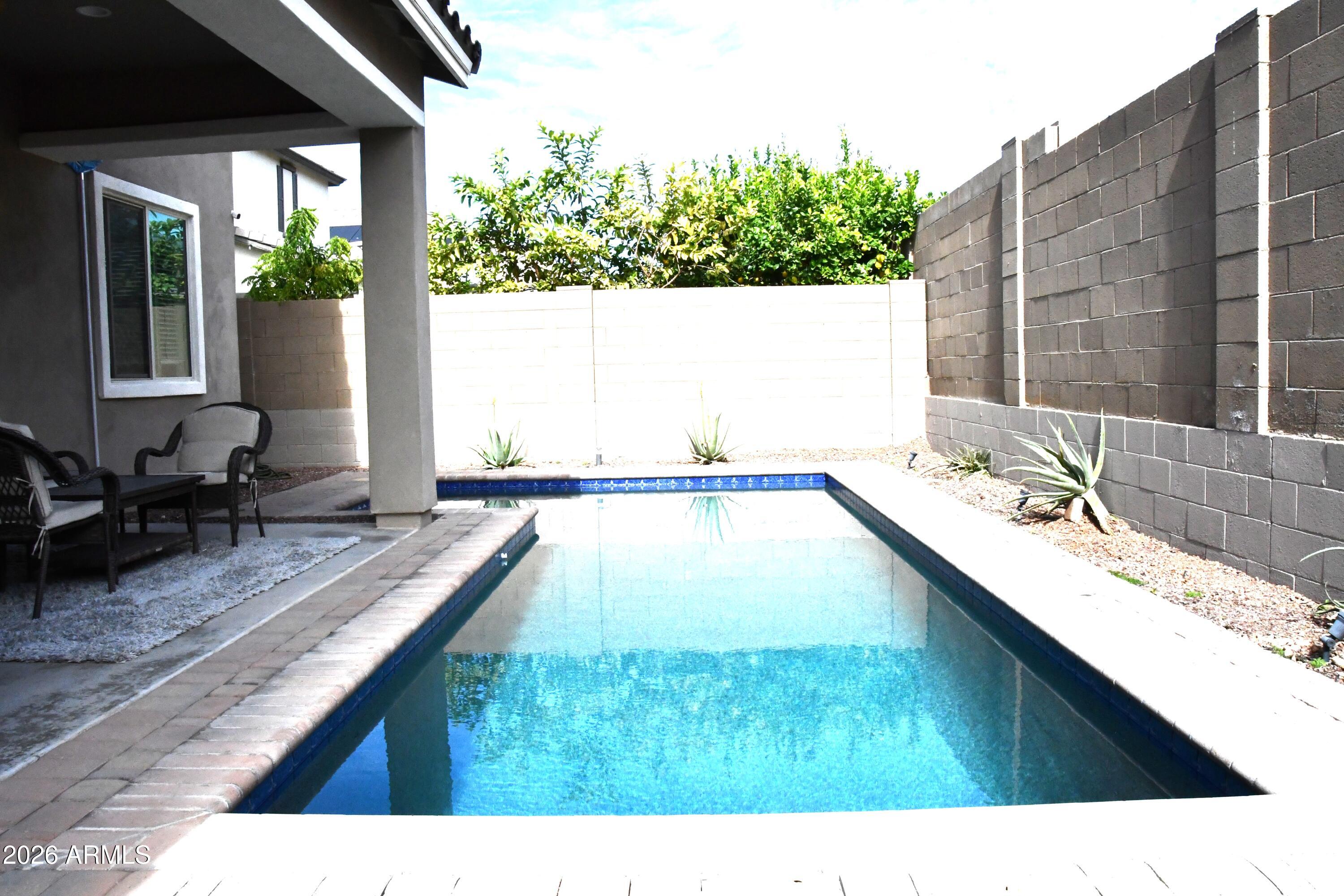 22419 97th Lane Peoria, AZ 85383 - Photo 19 of 22 a bathroom with a bathtub and a sink