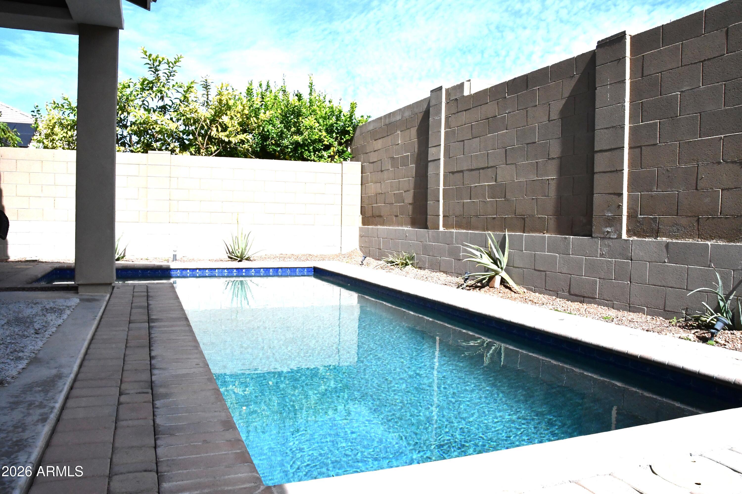 22419 97th Lane Peoria, AZ 85383 - Photo 21 of 22 a view of swimming pool with outdoor seating