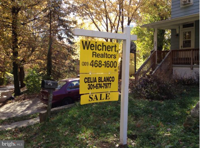 30 Ritchie Avenue Silver Spring, MD 20912 - Photo 3 of 11 a sign on the side of the road