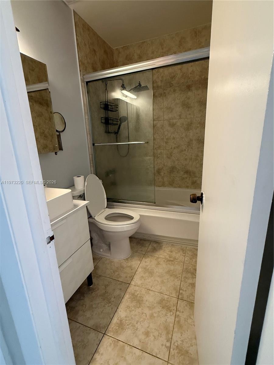 4255 Southwest 5th Terrace Miami, FL 33134 - Photo 13 of 29 a bathroom with a shower and a toilet