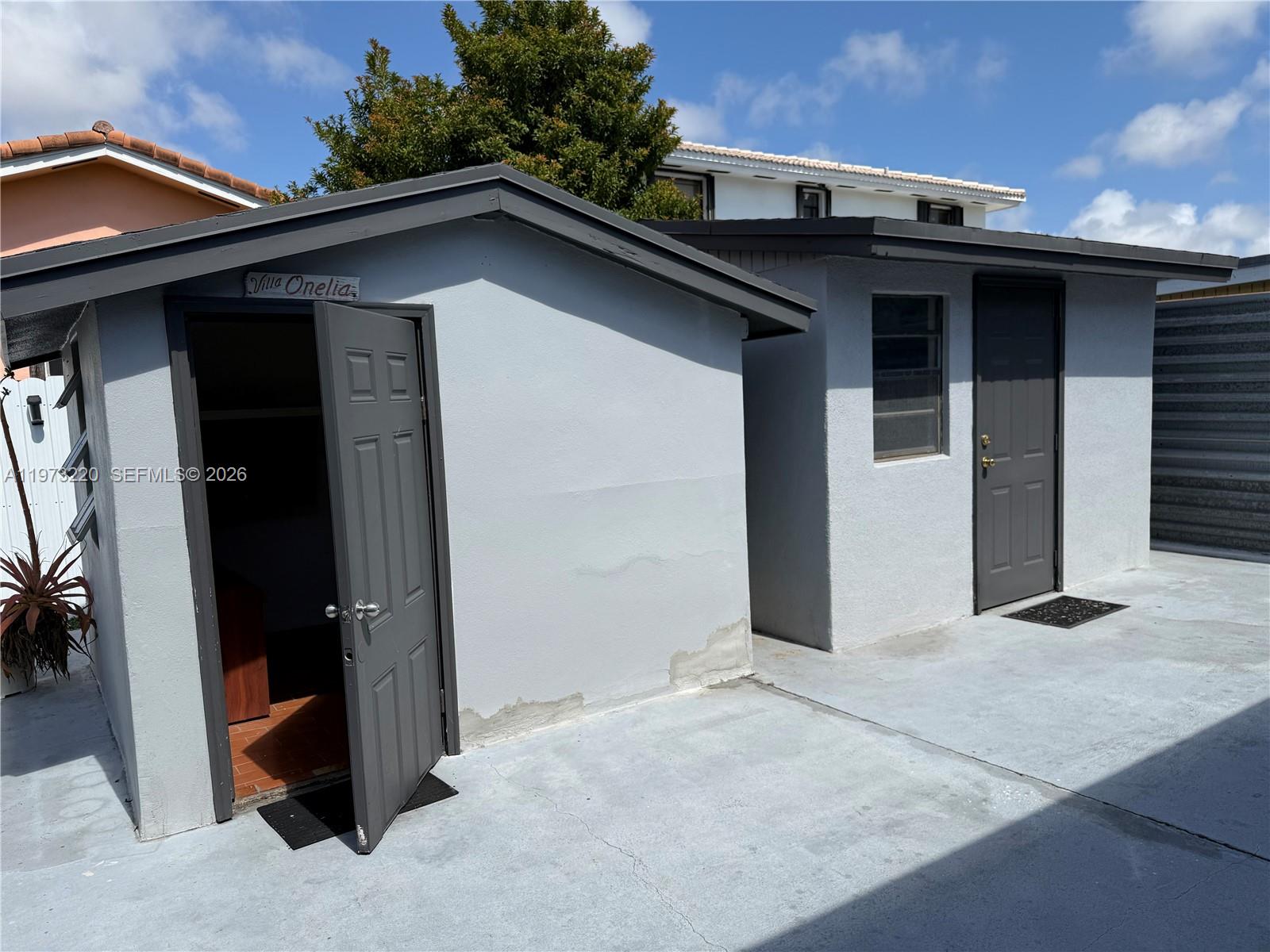 4255 Southwest 5th Terrace Miami, FL 33134 - Photo 18 of 29 a view of a house with a door and a outdoor space