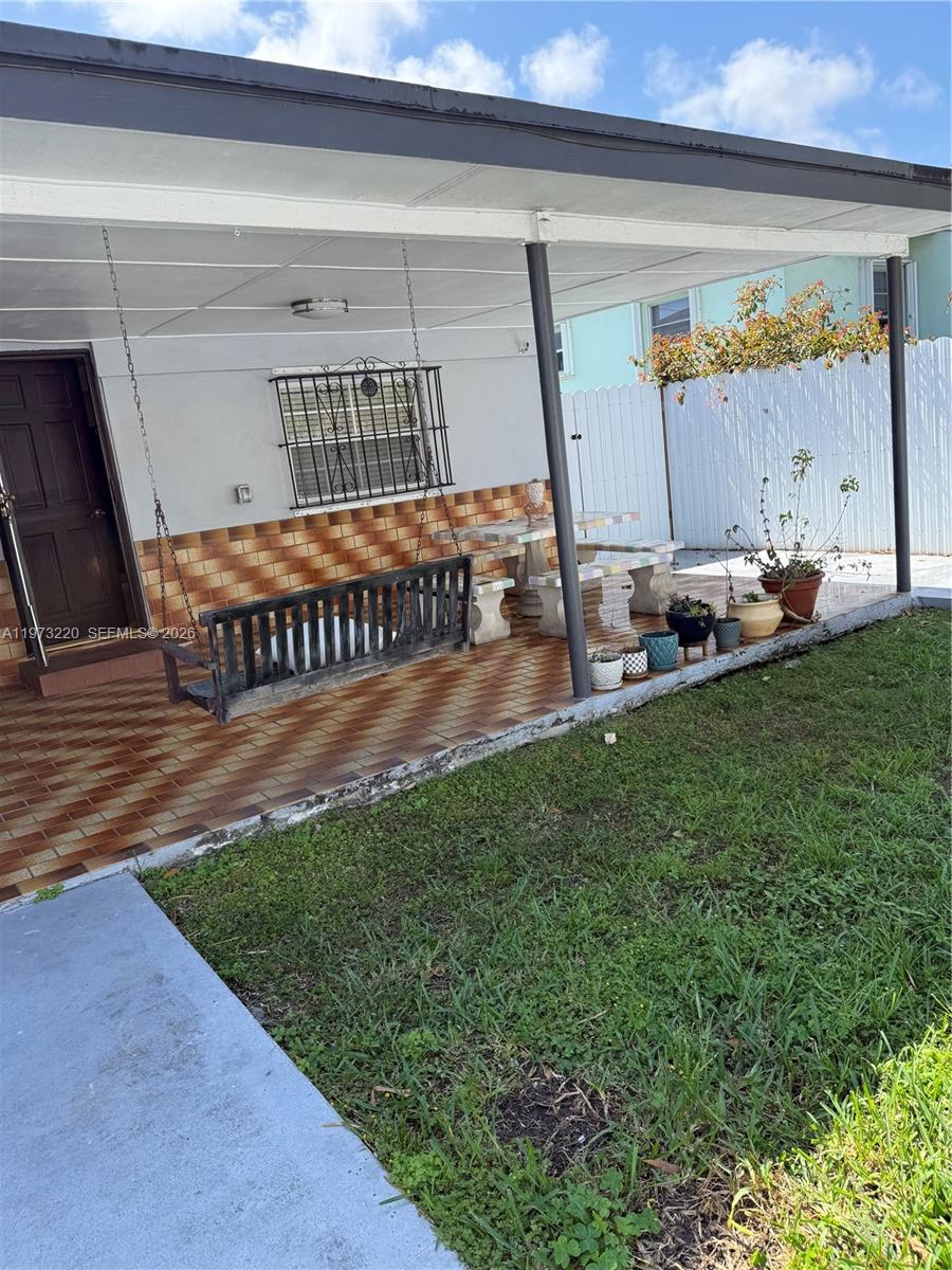 4255 Southwest 5th Terrace Miami, FL 33134 - Photo 25 of 29 a view of a backyard with a small cabin and a chair