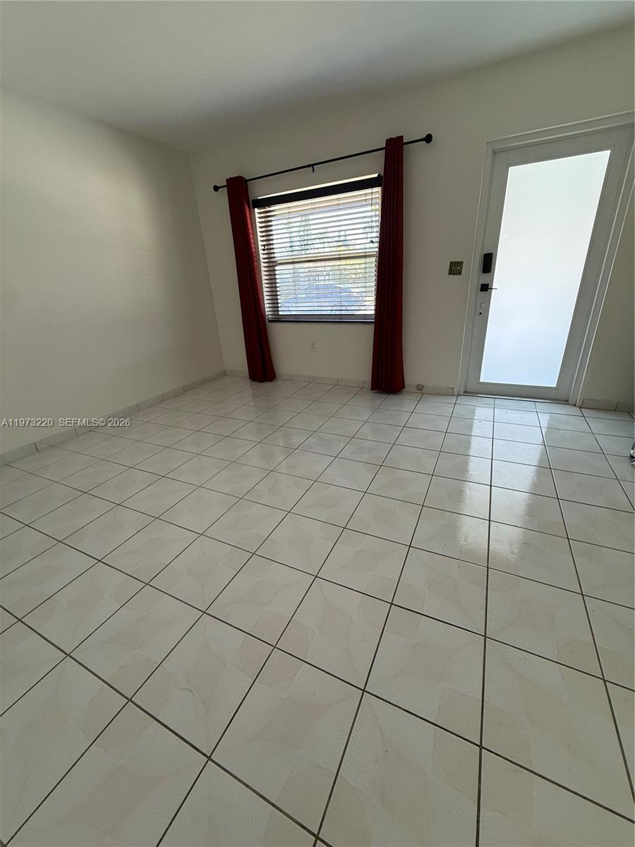 4255 Southwest 5th Terrace Miami, FL 33134 - Photo 27 of 29 an empty room with windows and closet