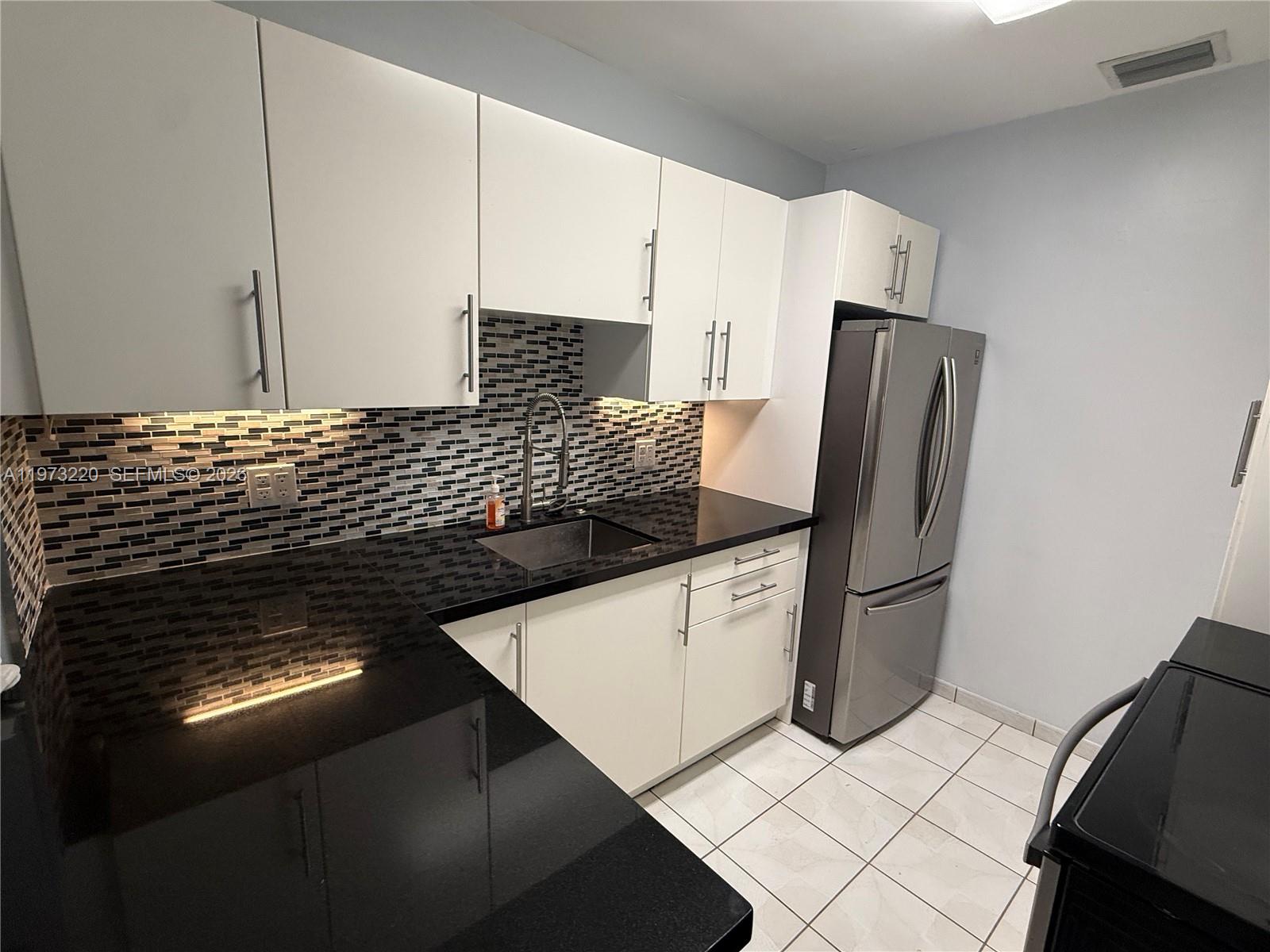 4255 Southwest 5th Terrace Miami, FL 33134 - Photo 7 of 29 a view of appliances and cabinets