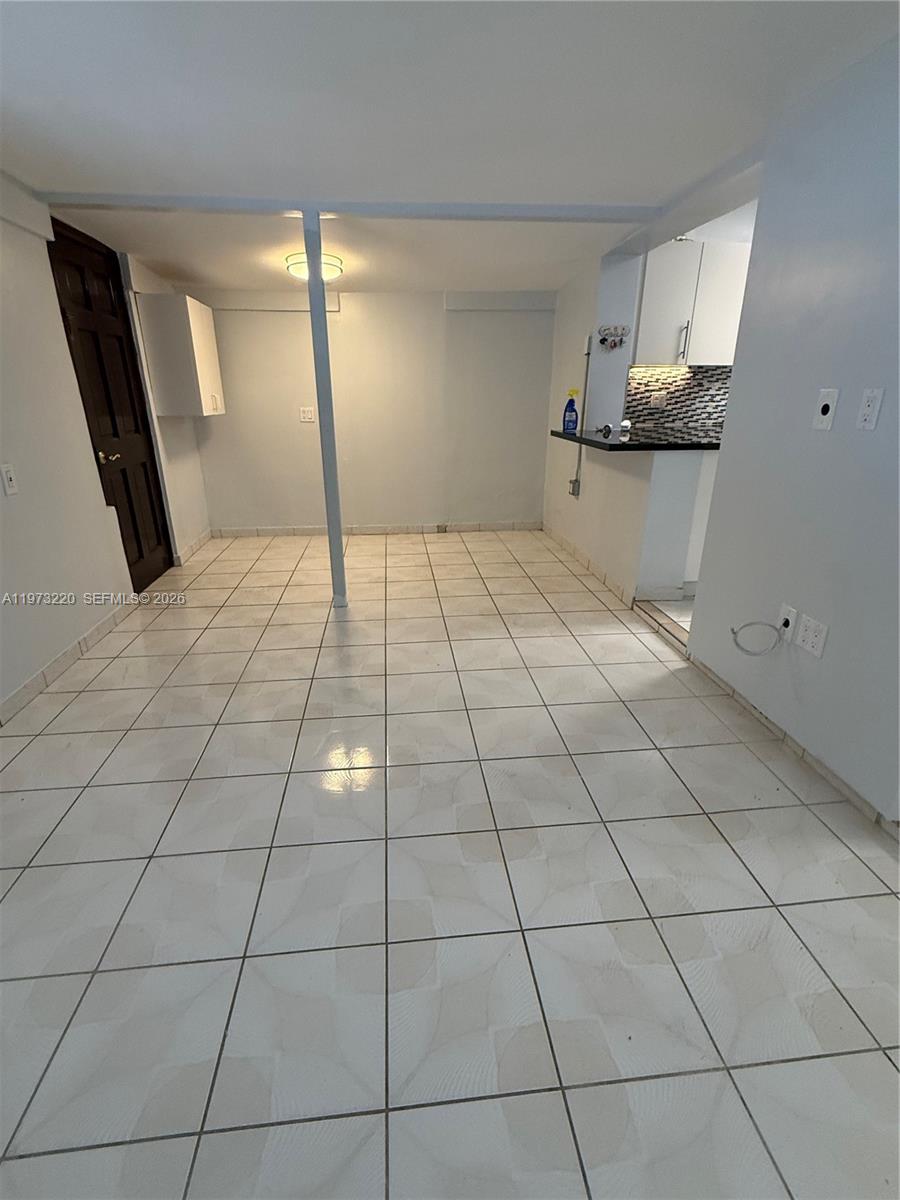 4255 Southwest 5th Terrace Miami, FL 33134 - Photo 9 of 29 a room with a black white checkered floor