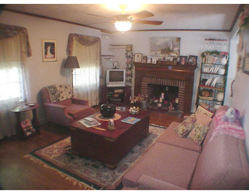 23 Virginia Road Arlington, MA 02476 - Photo 4 of 7 a living room with furniture and a fireplace