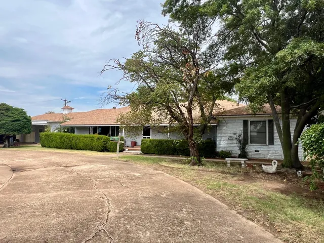 a patio with table and chairs