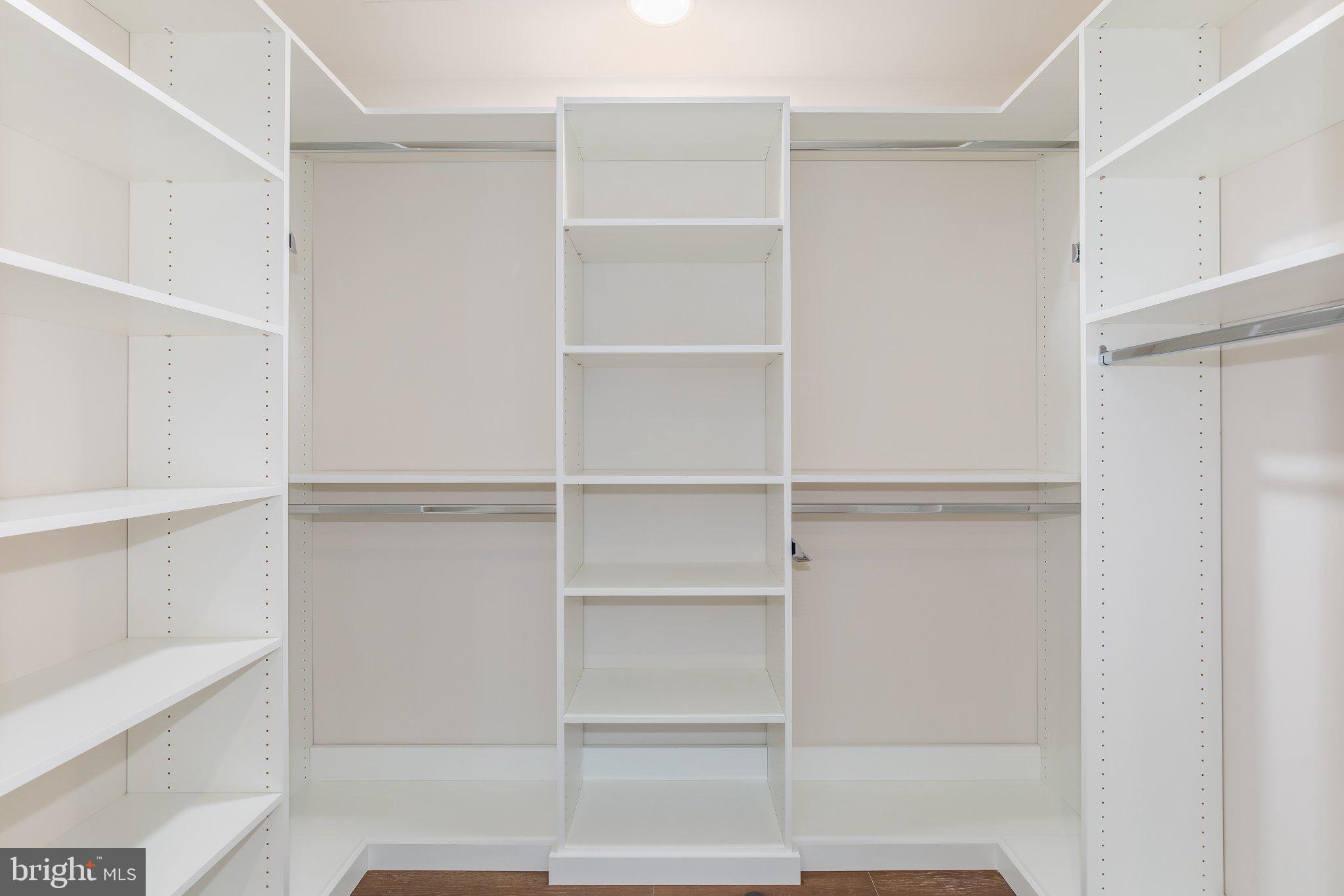 601 Wharf Street Southwest, Unit 203 Washington, DC 20024 - Photo 17 of 34 a view of walk in closet with empty racks
