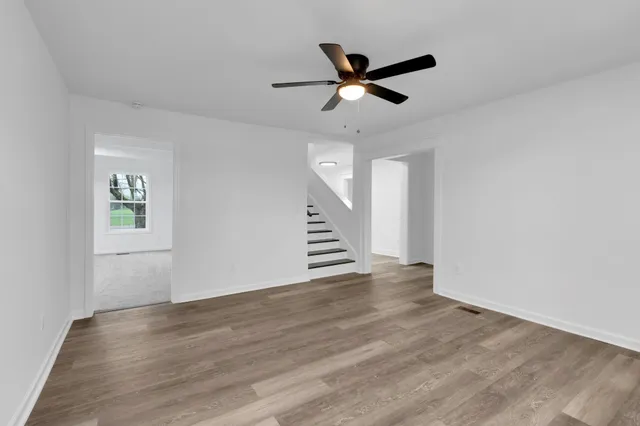 a view of a kitchen with a sink stainless steel appliances and cabinets