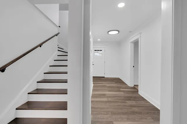 a kitchen with granite countertop a sink cabinets and window