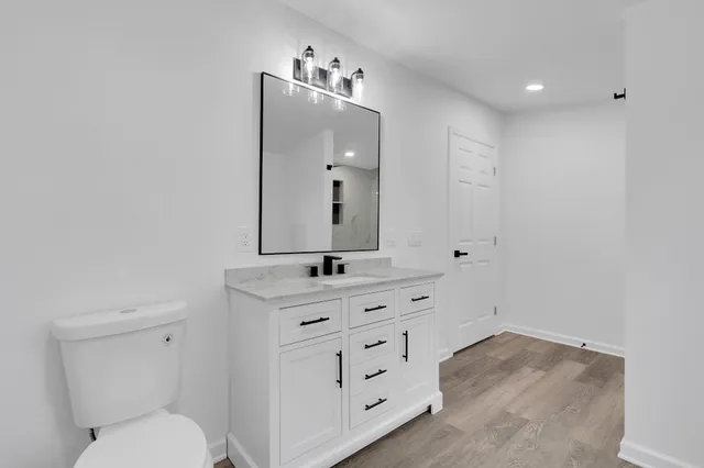 a bathroom with a glass shower door