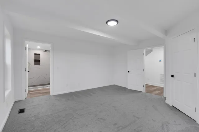 a white toilet sitting next to a bathroom sink