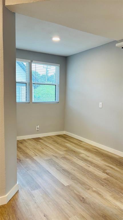 4603 Junius Street, Unit 4 Dallas, TX 75246 - Photo 9 of 14 a view of an empty room with a window