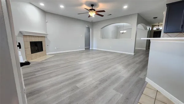 a view of a kitchen with a sink and a fireplace